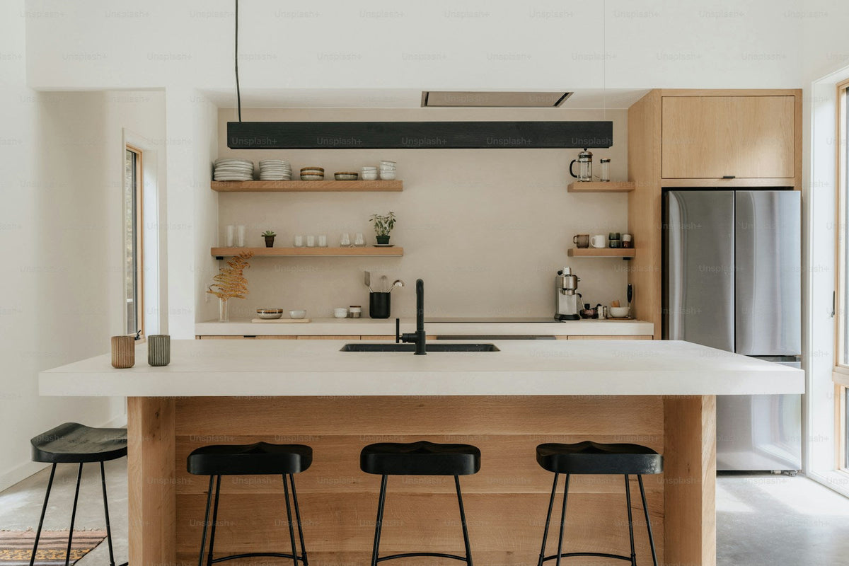 Counter stools arranged around a warm kitchen island