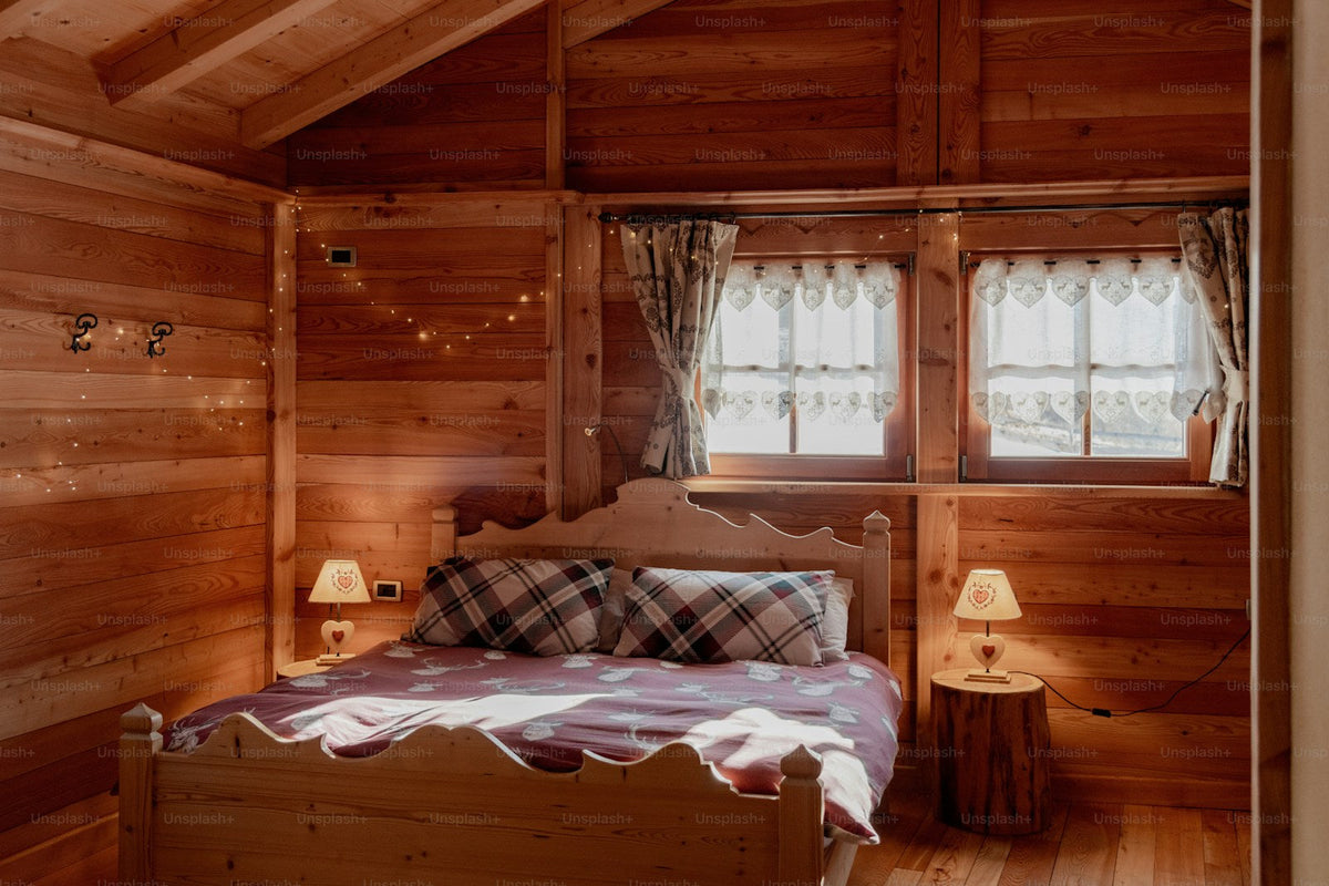 Cozy country bedroom furnished in warm natural wood