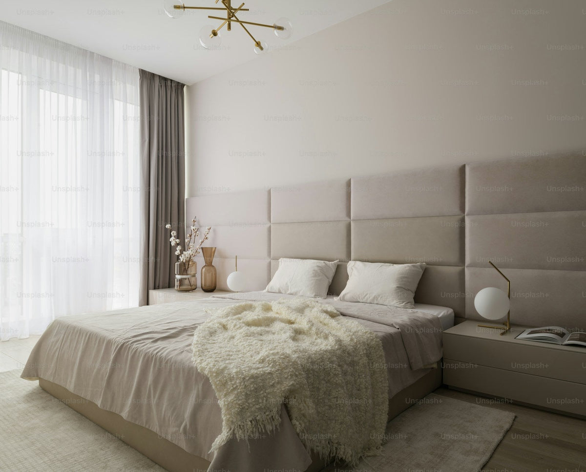Bed with a prominent decorative headboard