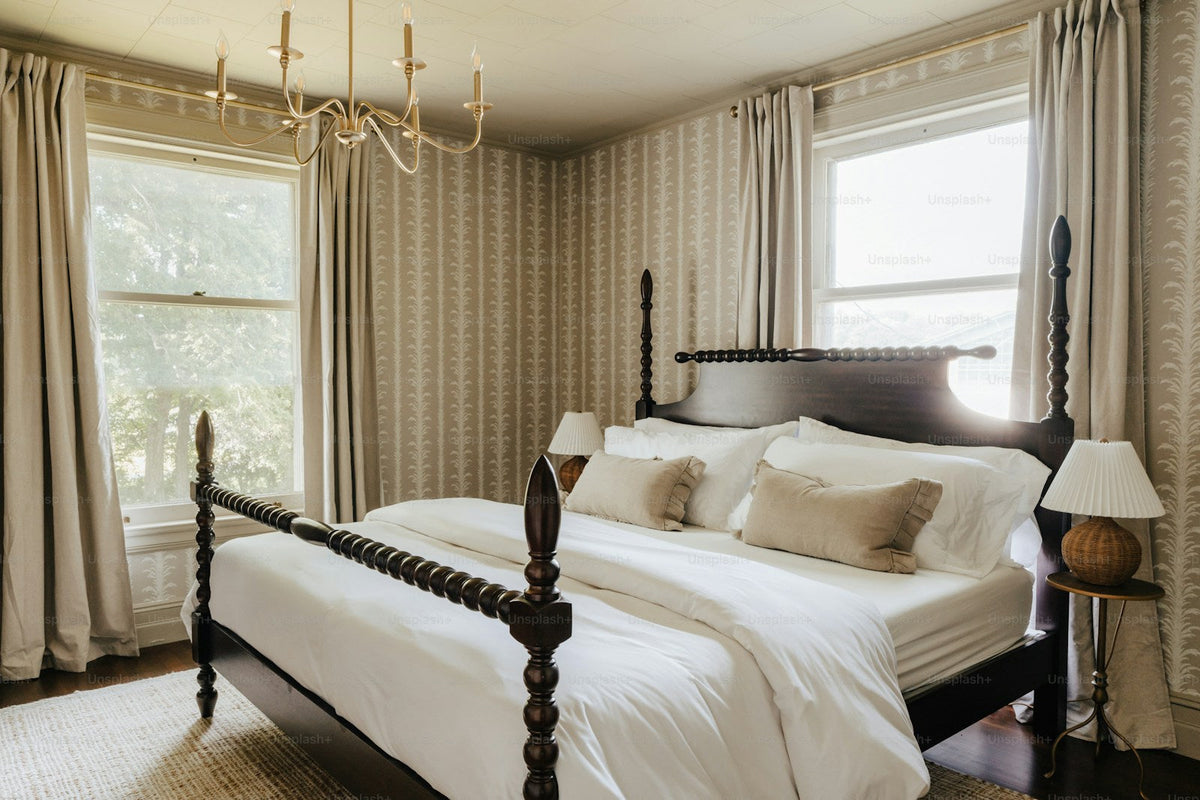 Four-poster canopy bed in a warm elegant bedroom