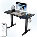 HUANUO 48" AI Smart Standing Desk with App-Synced Sedentary Reminders, Electric Height Adjustable Desk with Body-Data Ergonomic Presets, Voice Control Alexa/Google/Siri, 3 Memory Settings Table, Black