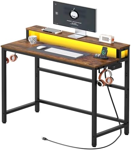 YATINEY Small Computer Desk with Charging Station and LED Lights, Gaming Desk with Monitor Stand, 2-Tier Home Office Desk with 4 Side Hooks, for Living Room, Home Office, Rustic Brown DN01UDBRY2